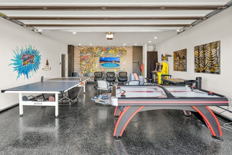 one of a kind recreation room. every kids dream room. ping pong, air hockey, free standing arcade games, even a 65" huge tv for Super Mario Brothers. Hours of fun in a temperature controlled room. Come see this unique play area.