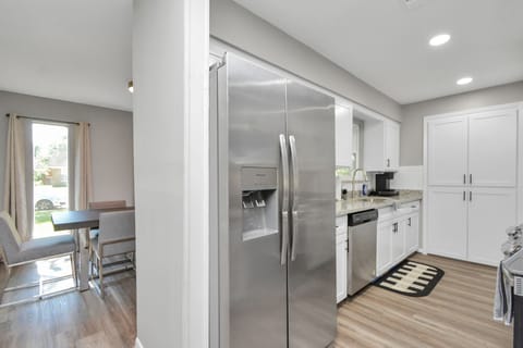 The kitchen & living room flow together seamlessly, making entertaining a breeze