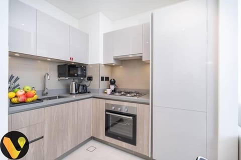 Luxury Apartment | Private kitchen | Full-size fridge, microwave, oven, stovetop