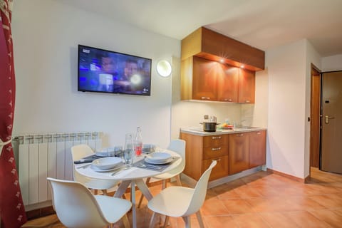 Family Apartment, 1 Bedroom (L' Aquila Campo Smith On The Ski) | Living area | 21-inch TV with cable channels