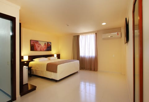 Deluxe Double Room | Minibar, in-room safe, desk, laptop workspace