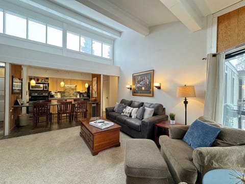 Living room with kitchen in background