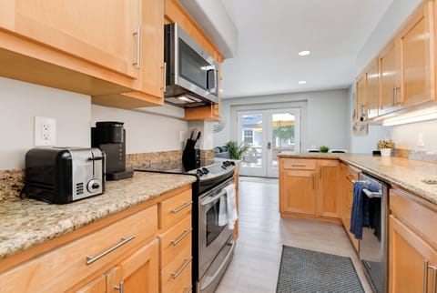 Fully equipped kitchen features a Keurig with a variety of K-cups for your convenience.