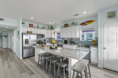 Enjoy cooking, eating or even board games together at the large island.