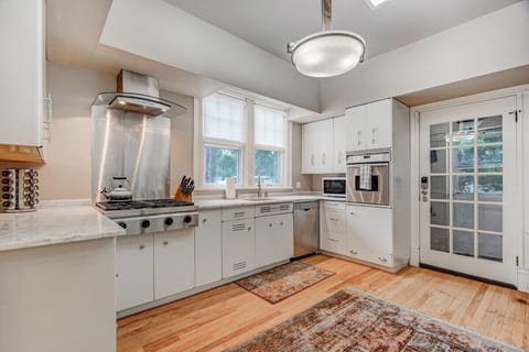 State-of-the-art kitchen is a chef's dream come true, featuring top-of-the-line appliances, granite countertops, and ample space to unleash your culinary creativity.