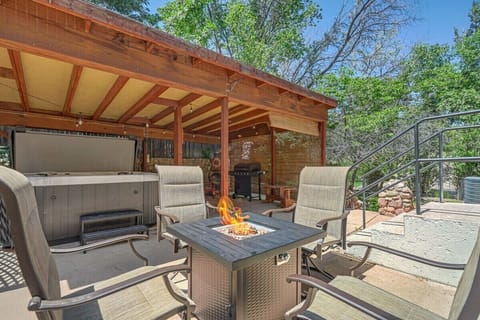 Evenings come alive with the fire table glow, a bubbling hot tub, and a grill ready for family meals.