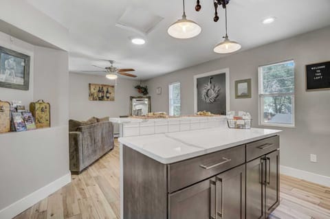 Cook and connect in this open-concept kitchen with a spacious island perfect for meal prep and gatherings.