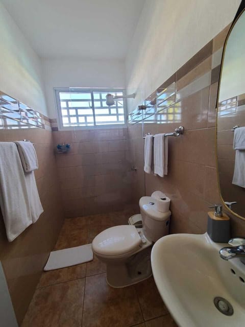 Standard Apartment | Bathroom | Shower, rainfall showerhead, hair dryer, towels