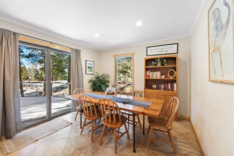 Dining area with balcony access and seating for eight