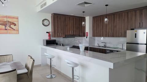 Deluxe Villa | Private kitchen | Full-size fridge, microwave, oven, dishwasher