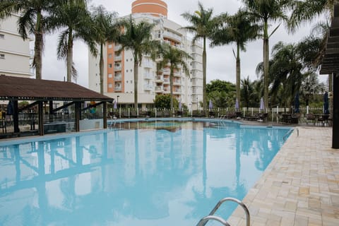 2 outdoor pools, open 8:00 AM to 10:00 PM, pool umbrellas, sun loungers