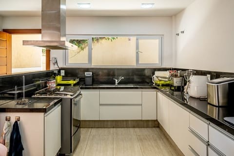 Villa | Private kitchen | Full-size fridge, microwave, oven, dishwasher