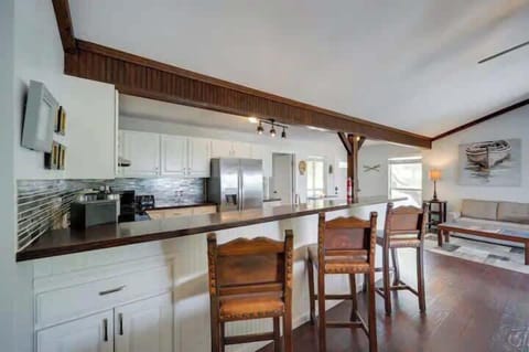 The large kitchen island opens up into the dining room for plenty of seating.