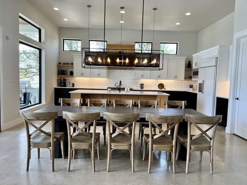 Kitchen and dinning area overlook the lake and are open to living area