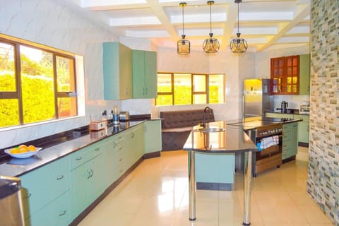 Villa | Private kitchen | Fridge, microwave, oven, stovetop