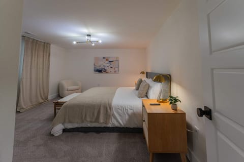 This spacious bedroom has a closet and window for light.