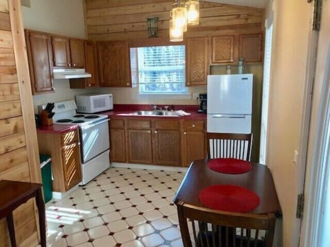 Full kitchen with dining area.
