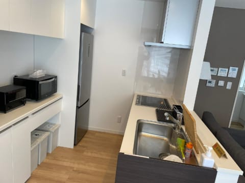 Comfort Villa | Private kitchen | Full-size fridge, microwave, toaster, rice cooker