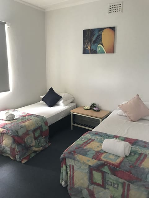 Standard Room, Shared Bathroom (Hotel Single) | Iron/ironing board, bed sheets