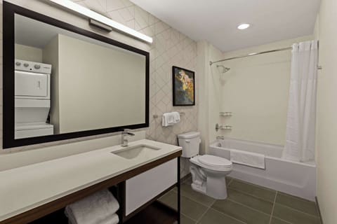 Suite, 1 King Bed, Non Smoking | Bathroom | Free toiletries, hair dryer, towels, soap