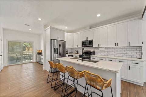 Large pantry and back yard access directly off the kitchen. There are also dog doors that feed through the garage for those who come with pets.