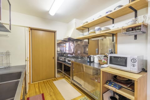 Design Apartment | Private kitchen | Full-size fridge, microwave, stovetop, dishwasher