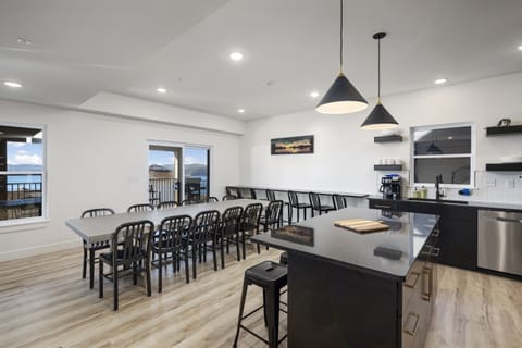 Tree House - Main Level: Kitchen and Dining Room seating 21 (12 at Dining Table and 9 on bar stools)