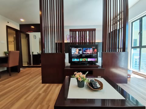 Executive Apartment (Rose) | Living area | 42-inch TV with cable channels