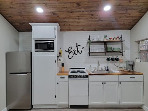 Fully stocked kitchen with cookware, pots and pans, basic cooking spices, and Keurig coffee maker!