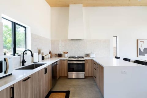 The stocked kitchen has a gas range, dishwasher, microwave, and refrigerator