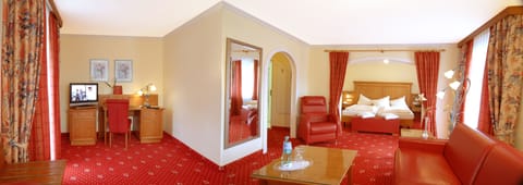 Junior Suite, Balcony | Minibar, in-room safe, desk, iron/ironing board