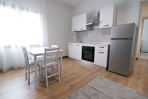 Comfort Apartment | Private kitchen | Full-size fridge, oven, stovetop, highchair