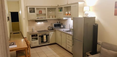 Comfort Double Room, 2 Bedrooms, Partial Ocean View, Beachside | Private kitchen | Full-size fridge, microwave, stovetop, coffee/tea maker