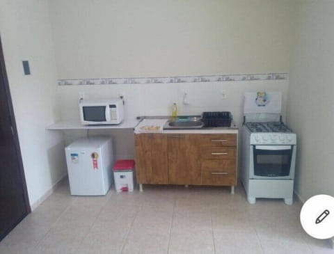 Full-size fridge, microwave, cookware/dishes/utensils