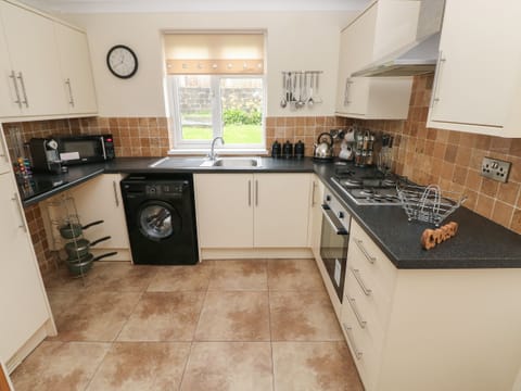 Fridge, electric kettle, toaster, cookware/dishes/utensils