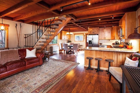 2nd floor is open concept and equipped with a bathroom, ample seating and a wood burning stove.