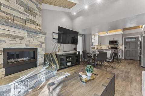 Photo of the living room, dining area, and kitchen