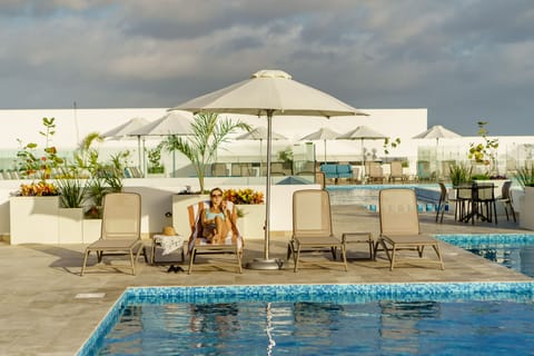 4 outdoor pools, open 9:00 AM to 10:00 PM, pool umbrellas, sun loungers
