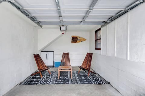 Cozy Garage Lounge: Unwind in this casual garage seating nook, perfect for morning coffee, post-beach chats, or planning your next adventure.