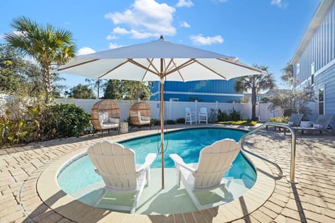 Private heated pool with covered sun shelf.