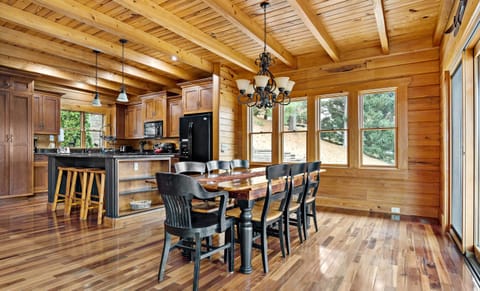 Large dining table near the open concept kitchen