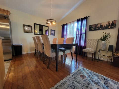 Dining room with seating for 8 - additional chairs are available in the garage.