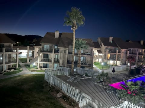 Night time view of pool from back balcony