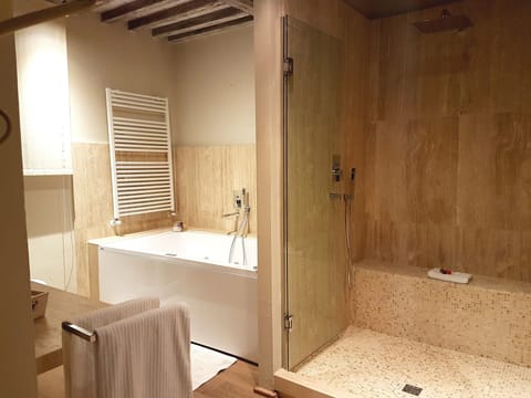 Junior Suite, Patio | Bathroom | Hair dryer, bathrobes, slippers, towels