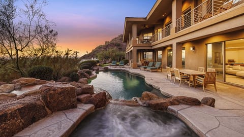 Modern multi-level home with pool, spa, and stunning sunset views.