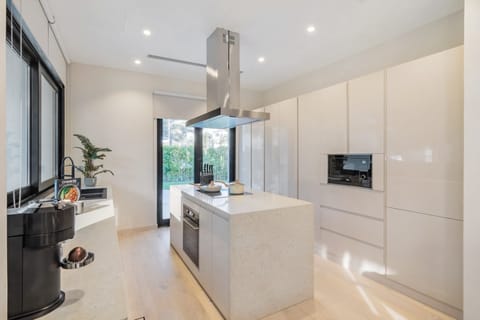 Open plan kitchen opening onto garden area