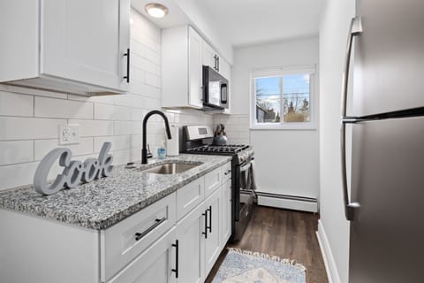 "Wake up to the sound of the rain falling outside, as you relax in this luxurious bathroom with a walk-in shower and marble countertop."