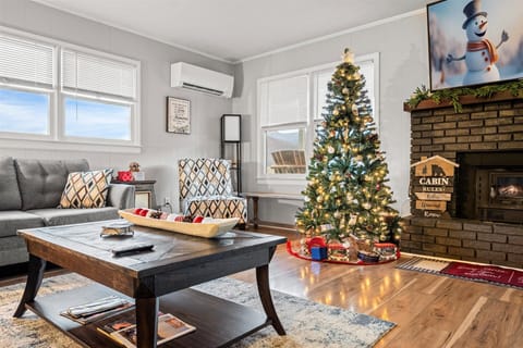 Cozy living room decorated for the holidays, offering comfort and festive charm.