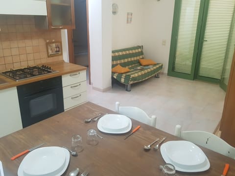 Apartment | Private kitchen | Full-size fridge, oven, stovetop, cookware/dishes/utensils