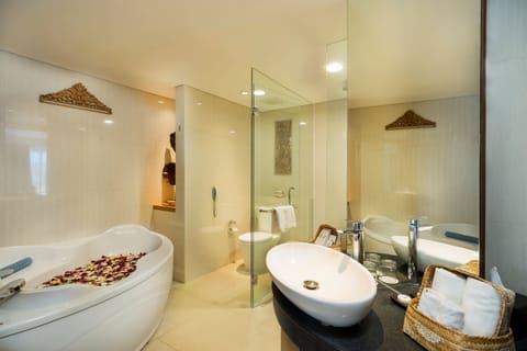 Junior Suite Pool View | Bathroom | Hair dryer, slippers, towels